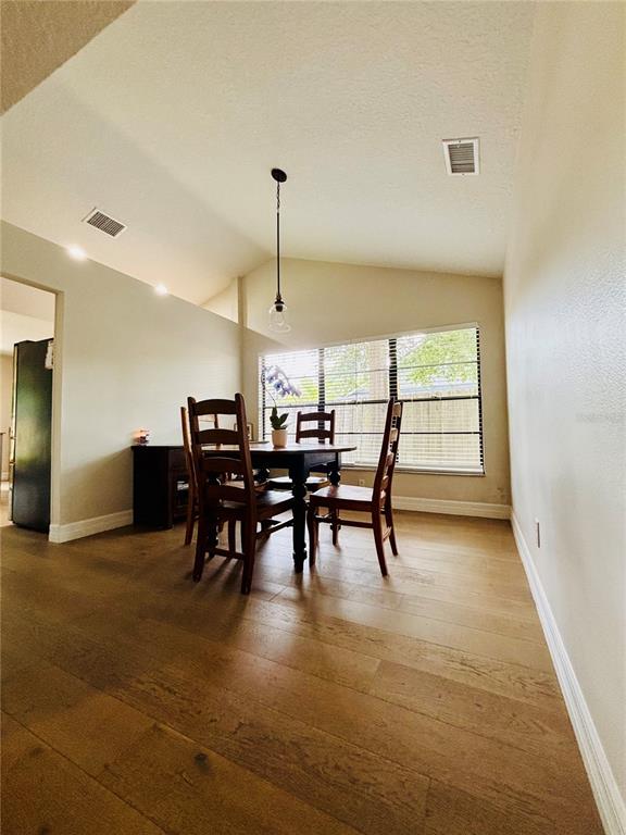 1045 Shaffer Trail Oviedo, FL 32765 - Photo 6 of 30 a view of a dining room with furniture and a chandelier