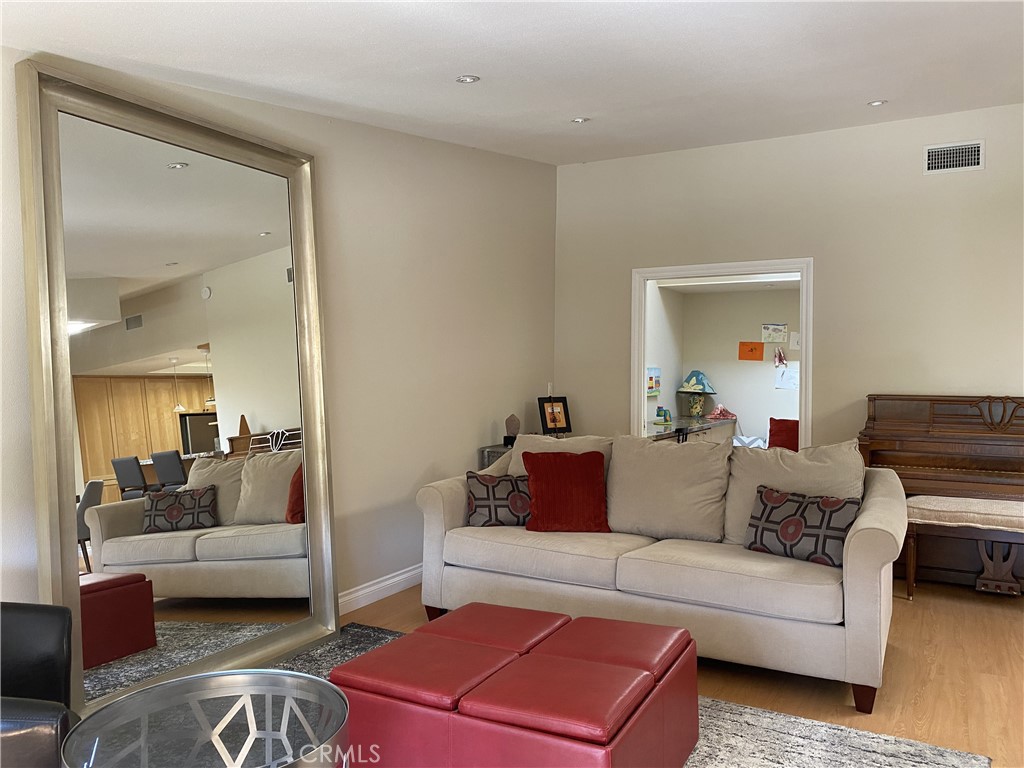 1771 Sunningdale Road Seal Beach, CA 90740 - Photo 11 of 30 a living room with furniture and a couch