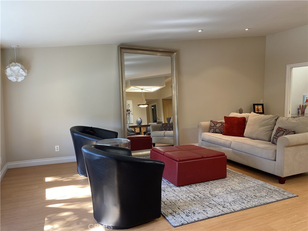 1771 Sunningdale Road Seal Beach, CA 90740 - Photo 13 of 30 a living room with couches and a coffee table