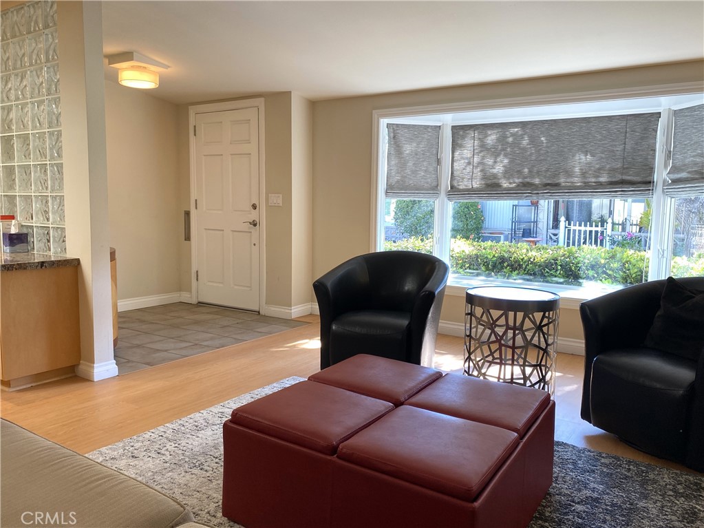 1771 Sunningdale Road Seal Beach, CA 90740 - Photo 14 of 30 a balcony with furniture and a potted plant
