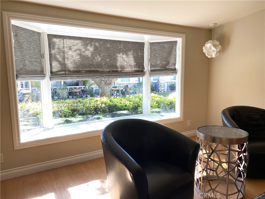 1771 Sunningdale Road Seal Beach, CA 90740 - Photo 15 of 30 a living room filled with furniture and a large window