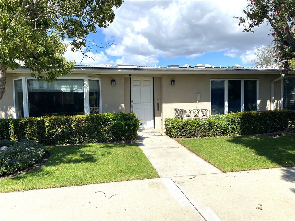 1771 Sunningdale Road Seal Beach, CA 90740 - Photo 2 of 30 a front view of a house with a yard and potted plants
