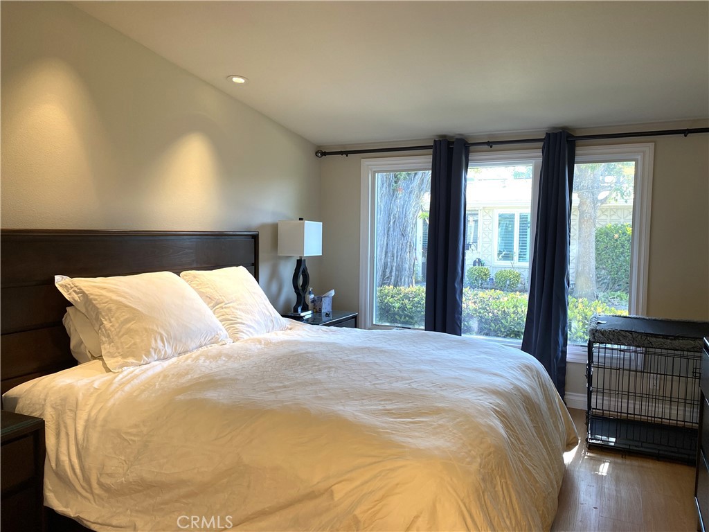 1771 Sunningdale Road Seal Beach, CA 90740 - Photo 24 of 30 a large bed sitting in a bedroom next to a window
