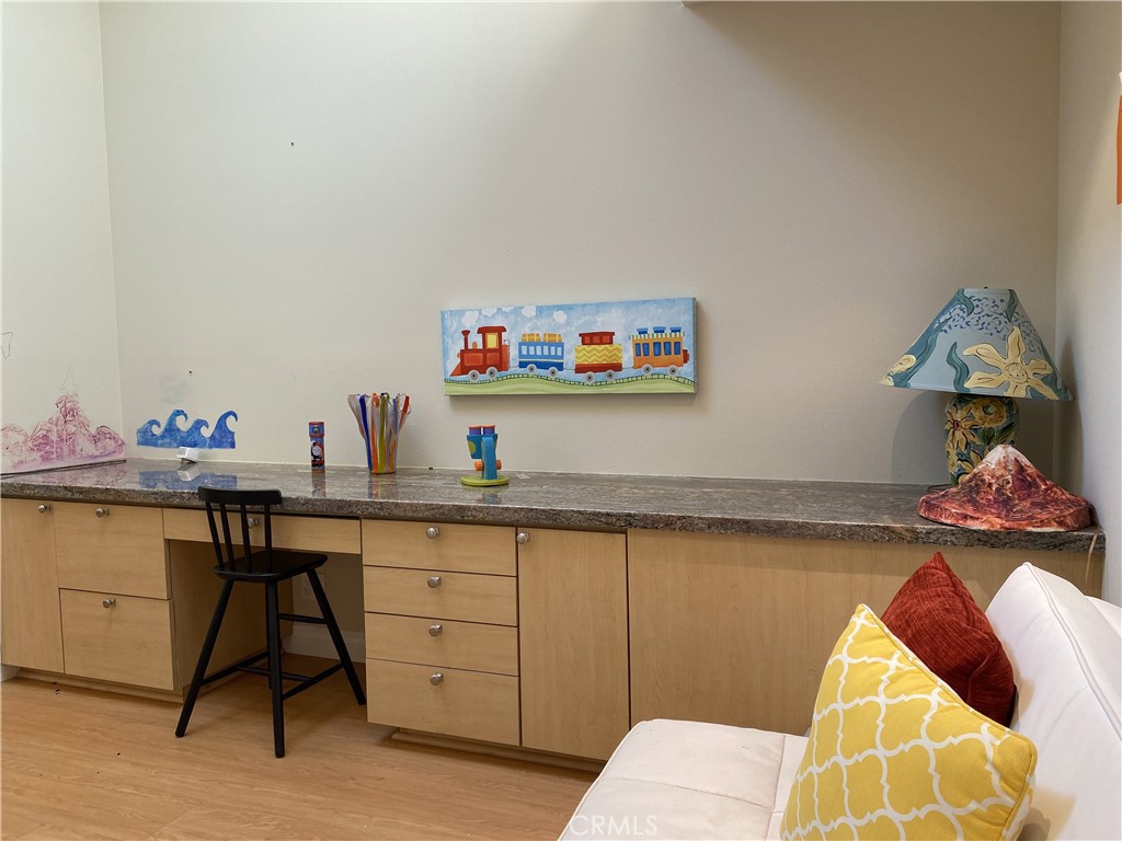1771 Sunningdale Road Seal Beach, CA 90740 - Photo 29 of 30 a view of a dining room with furniture and wooden floor