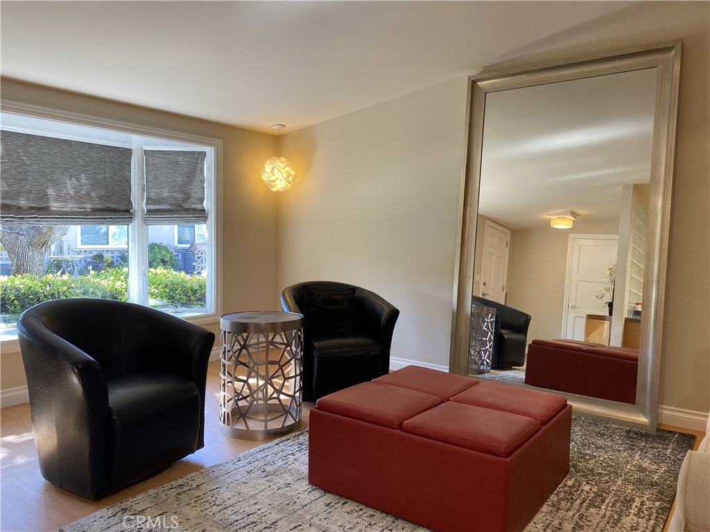 1771 Sunningdale Road Seal Beach, CA 90740 - Photo 4 of 30 a living room with furniture and a window