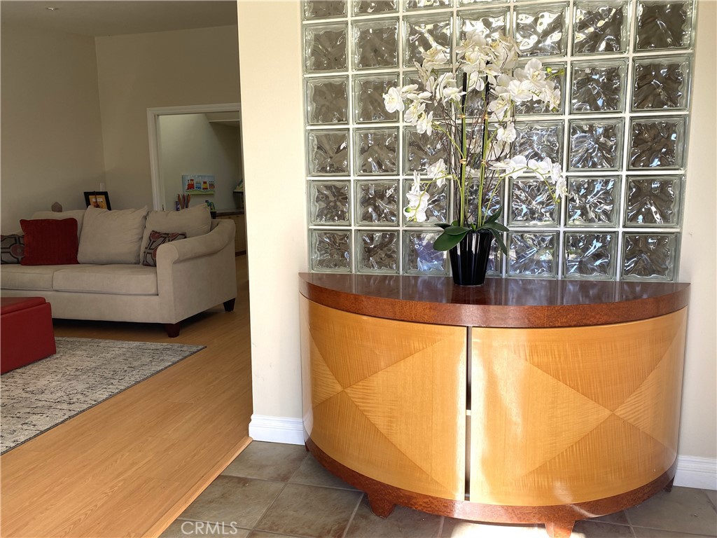 1771 Sunningdale Road Seal Beach, CA 90740 - Photo 5 of 30 a living room with couches and painted walls with wooden floor