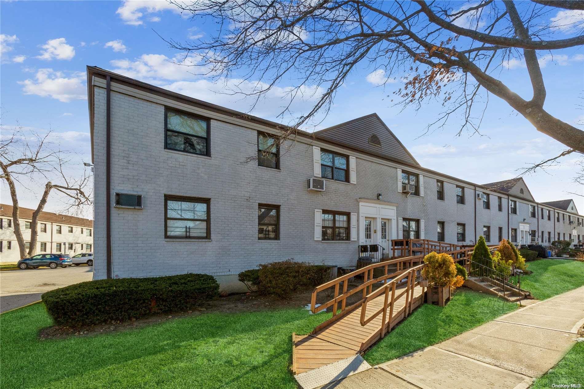 136-12 68th Drive, Unit A Queens, NY 11367 - Photo 1 of 1 a view of a house with a yard