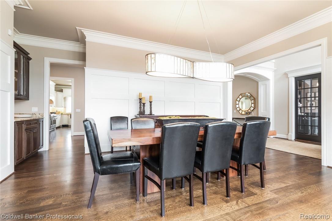 3762 Thatcher Drive Rochester, MI 48309 - Photo 16 of 76 Dining are with butlers pantry, wainscoting, and supreme detailed crown moulding