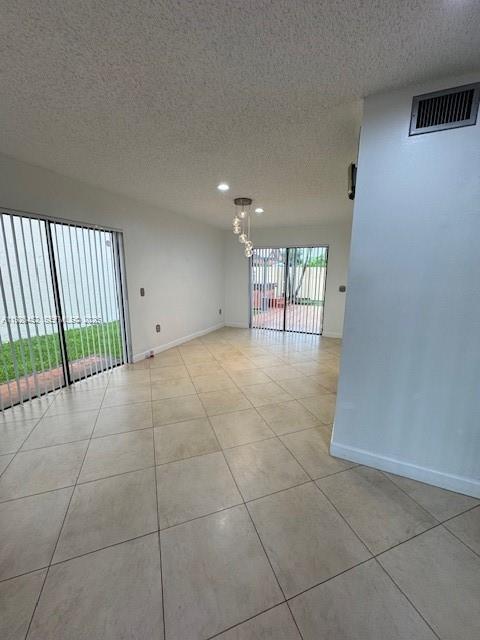 6311 Southwest 127th Court, Unit 6311 Miami, FL 33183 - Photo 2 of 13 a view of an empty room with a window