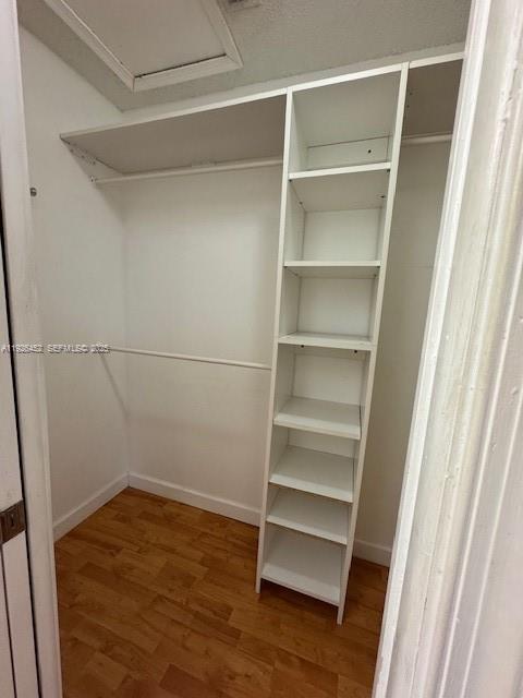 6311 Southwest 127th Court, Unit 6311 Miami, FL 33183 - Photo 8 of 13 a view of walk in closet with empty racks