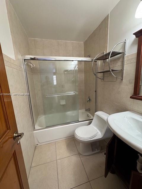 6311 Southwest 127th Court, Unit 6311 Miami, FL 33183 - Photo 10 of 13 a bathroom with a sink a toilet and a shower