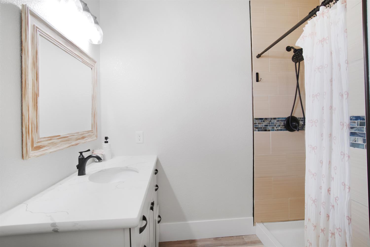 7991 South Shingle Road Shingle Springs, CA 95682 - Photo 38 of 58 a white bath tub sitting next to a white sink and vanity