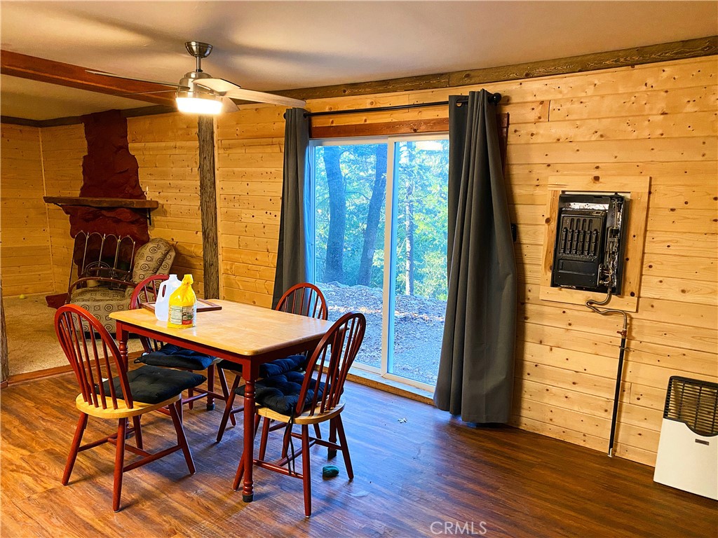 22166 Crestline Road Palomar Mountain, CA 92060 - Photo 11 of 58 a view of a dining room with furniture window and wooden floor