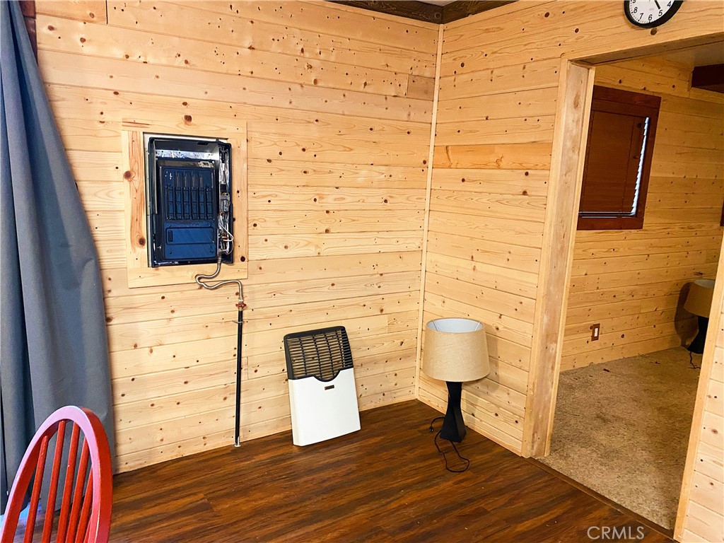 22166 Crestline Road Palomar Mountain, CA 92060 - Photo 13 of 58 a view of a door and chair in wooden floor