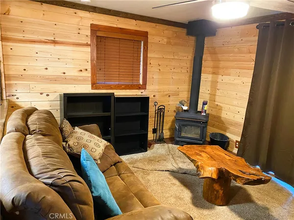 a view of storage and utility room with wooden floor
