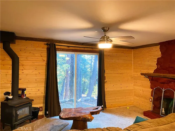 a view of a brick house with a yard