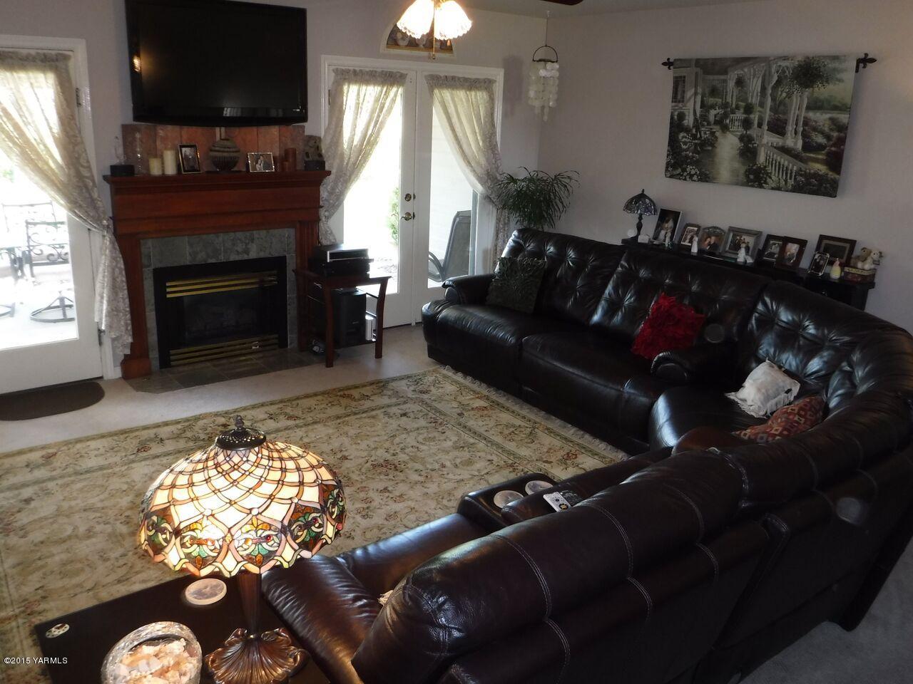 11301 Summitview Ext Road Yakima, WA 98908 - Photo 12 of 45 a living room with furniture and a fireplace