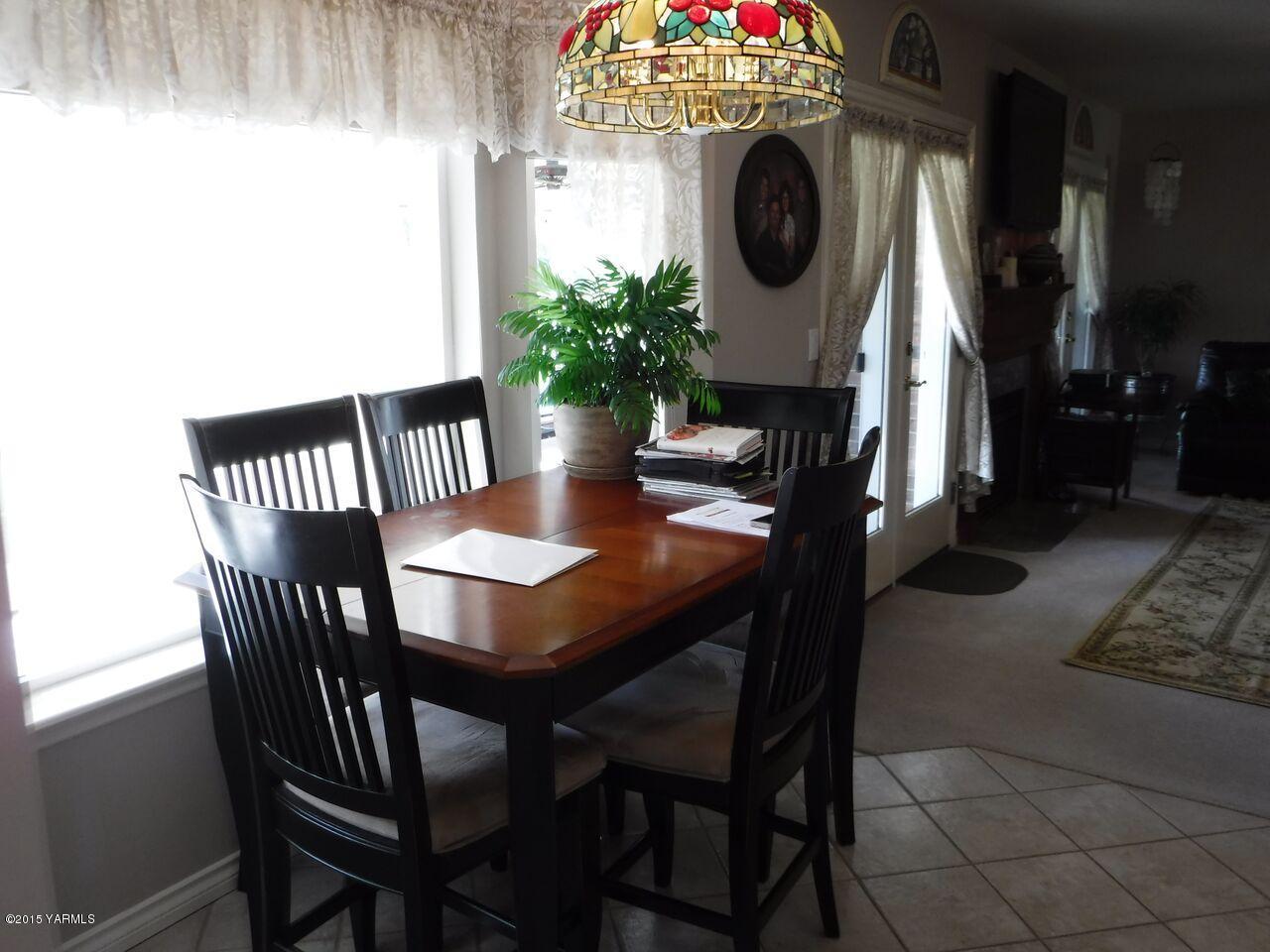 11301 Summitview Ext Road Yakima, WA 98908 - Photo 20 of 45 a view of a dining room with furniture and chandelier