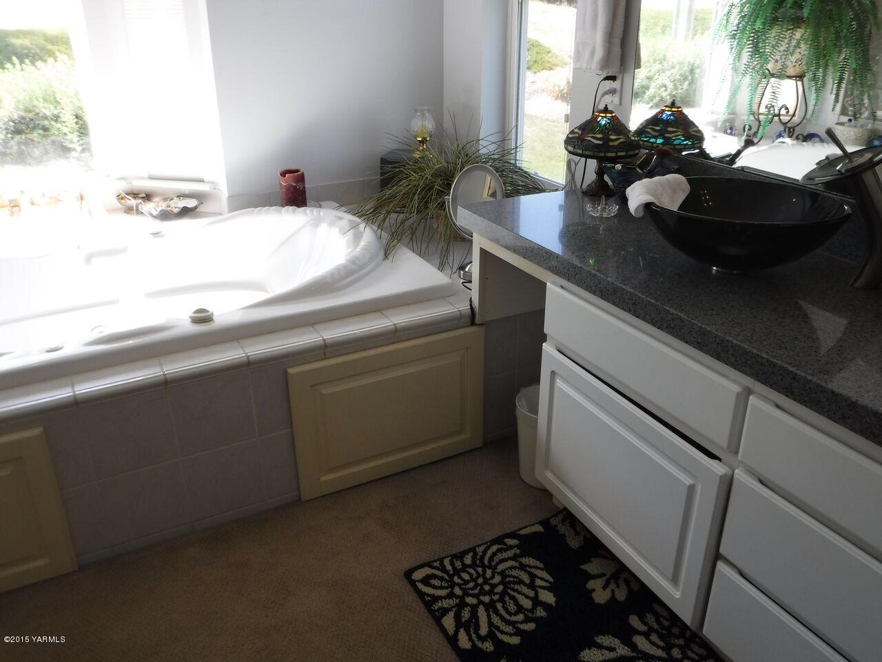 11301 Summitview Ext Road Yakima, WA 98908 - Photo 27 of 45 a bathroom with a sink and a window