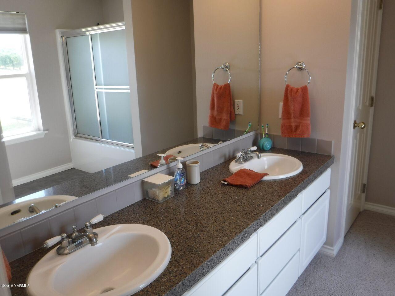 11301 Summitview Ext Road Yakima, WA 98908 - Photo 31 of 45 a bathroom with a sink and a mirror