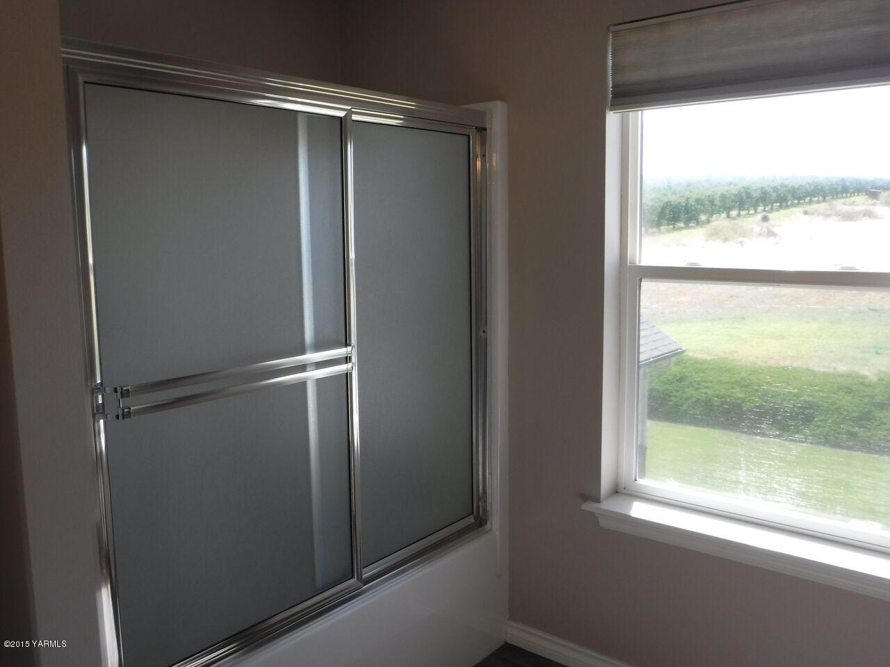 11301 Summitview Ext Road Yakima, WA 98908 - Photo 32 of 45 a bathroom with a glass shower door