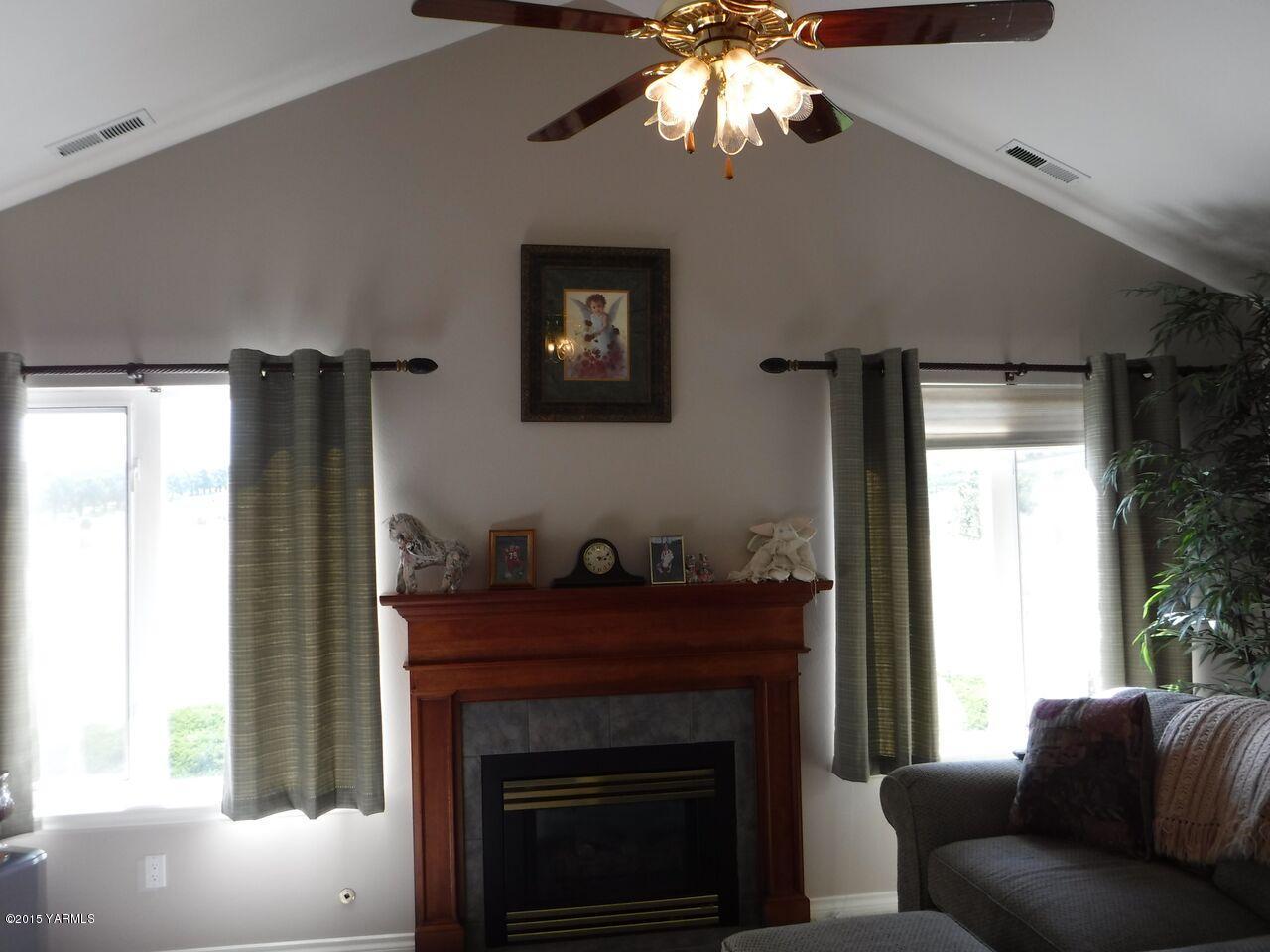 11301 Summitview Ext Road Yakima, WA 98908 - Photo 40 of 45 a living room with furniture and a fireplace