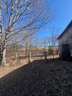 403 Woodard Road Lafayette, TN 37083 - Photo 12 of 21 a view of a backyard of the house