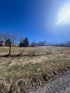 403 Woodard Road Lafayette, TN 37083 - Photo 15 of 21 a view of a field with an ocean