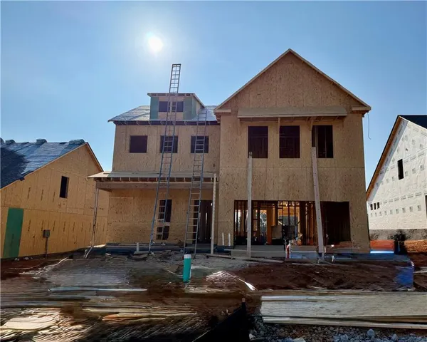 a front view of a house with yard