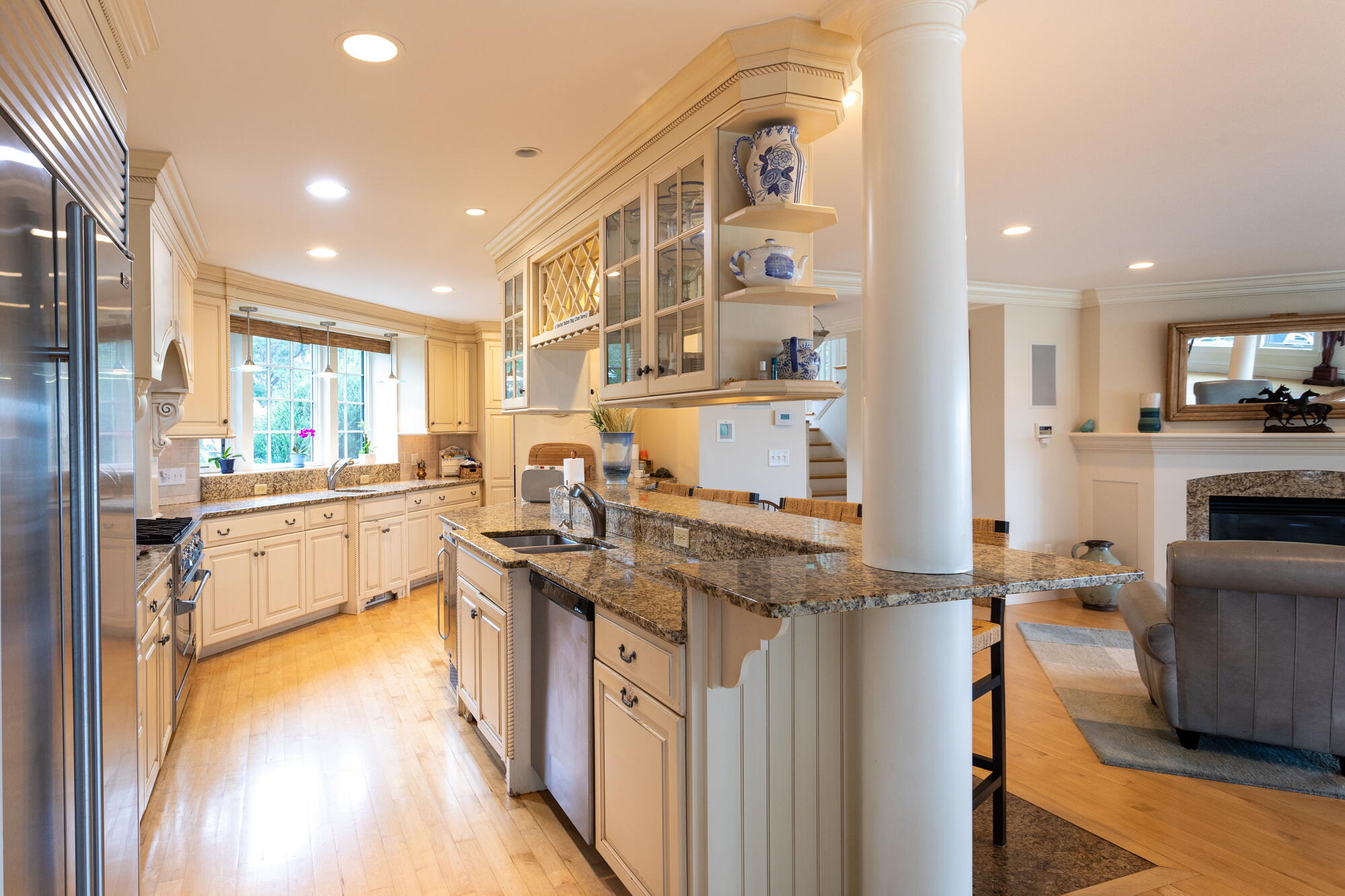 157 Monomoscoy Road Mashpee, MA 02649 - Photo 11 of 43 a kitchen with stainless steel appliances granite countertop a sink stove and refrigerator