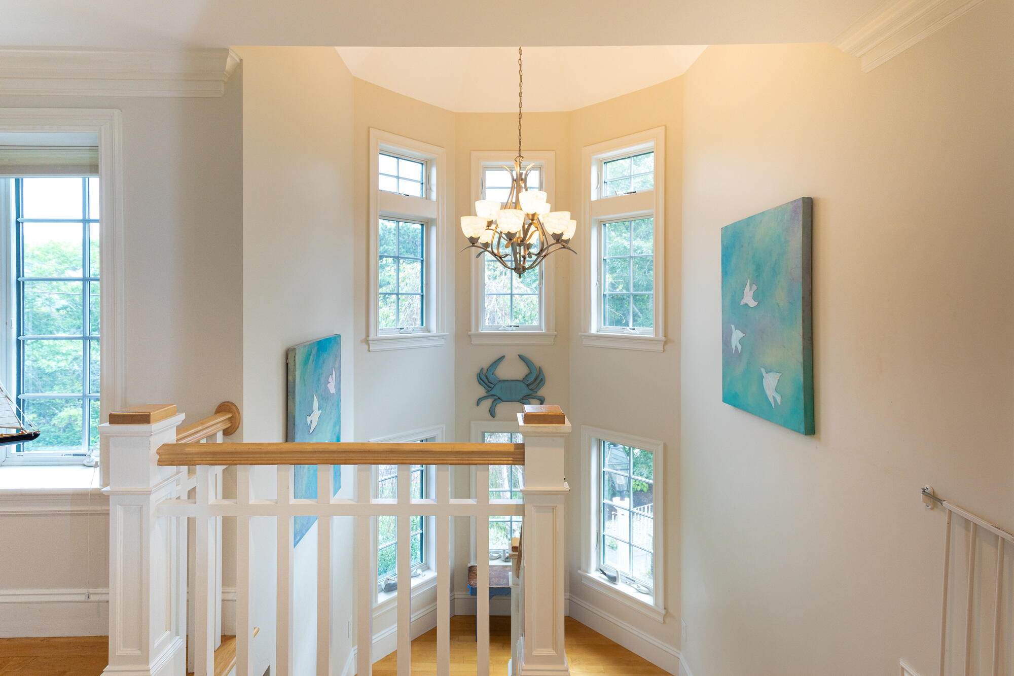157 Monomoscoy Road Mashpee, MA 02649 - Photo 19 of 43 a living room with furniture and a chandelier