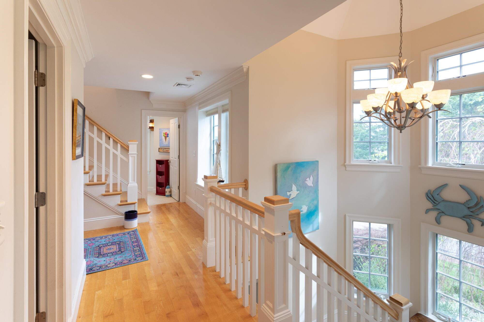 157 Monomoscoy Road Mashpee, MA 02649 - Photo 20 of 43 a view of a hallway with furniture and chandelier
