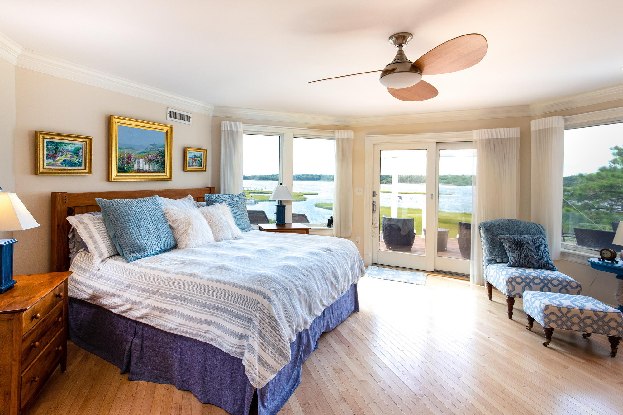 157 Monomoscoy Road Mashpee, MA 02649 - Photo 21 of 43 a spacious bedroom with a large bed and a large window