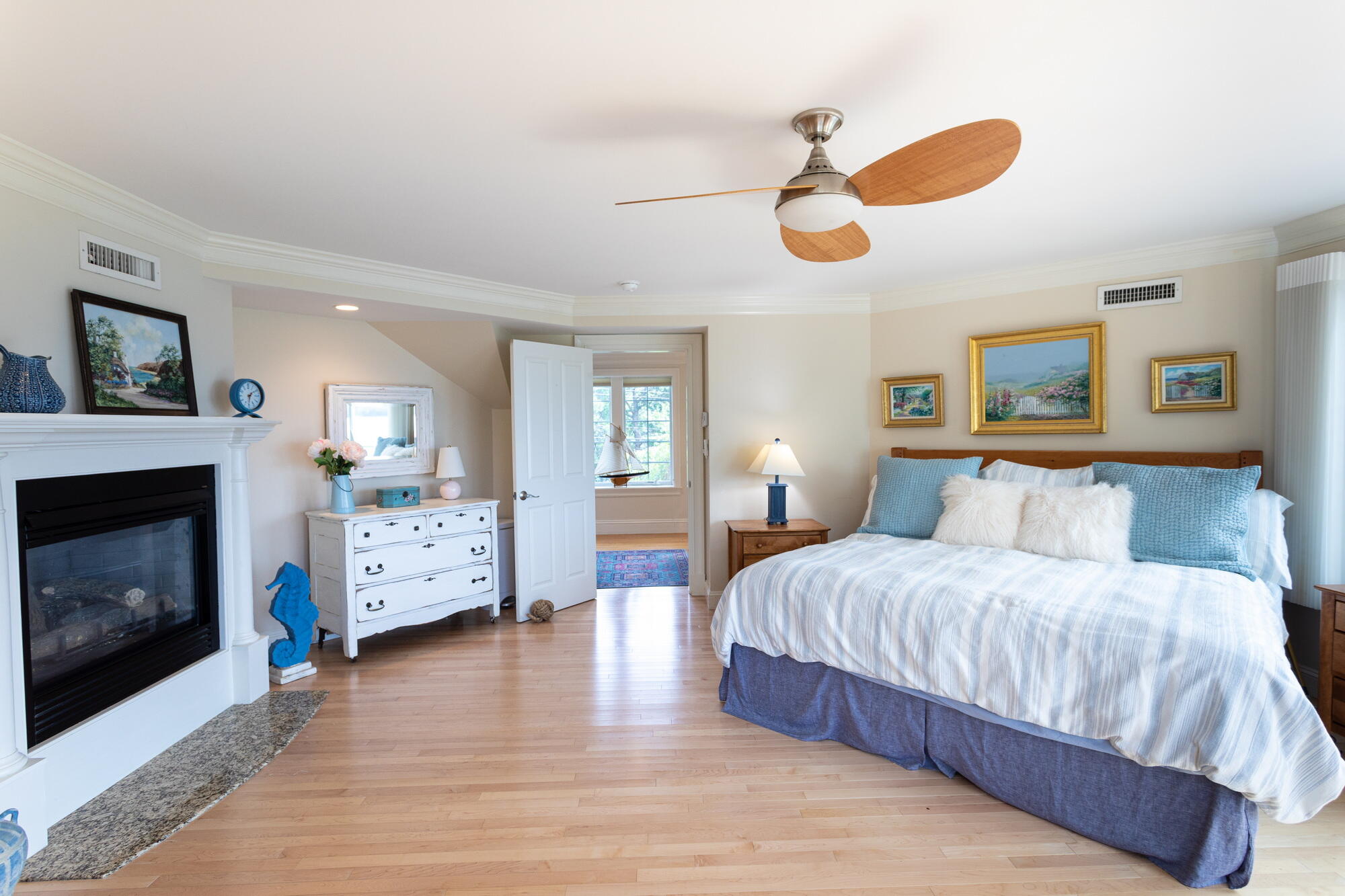 157 Monomoscoy Road Mashpee, MA 02649 - Photo 22 of 43 a bedroom with a bed and a fireplace