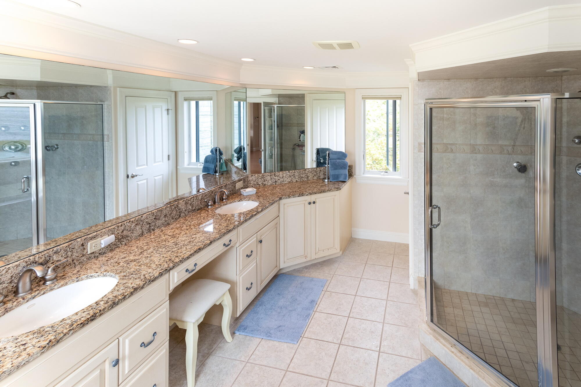 157 Monomoscoy Road Mashpee, MA 02649 - Photo 25 of 43 a large bathroom with a granite countertop shower a sink and a mirror