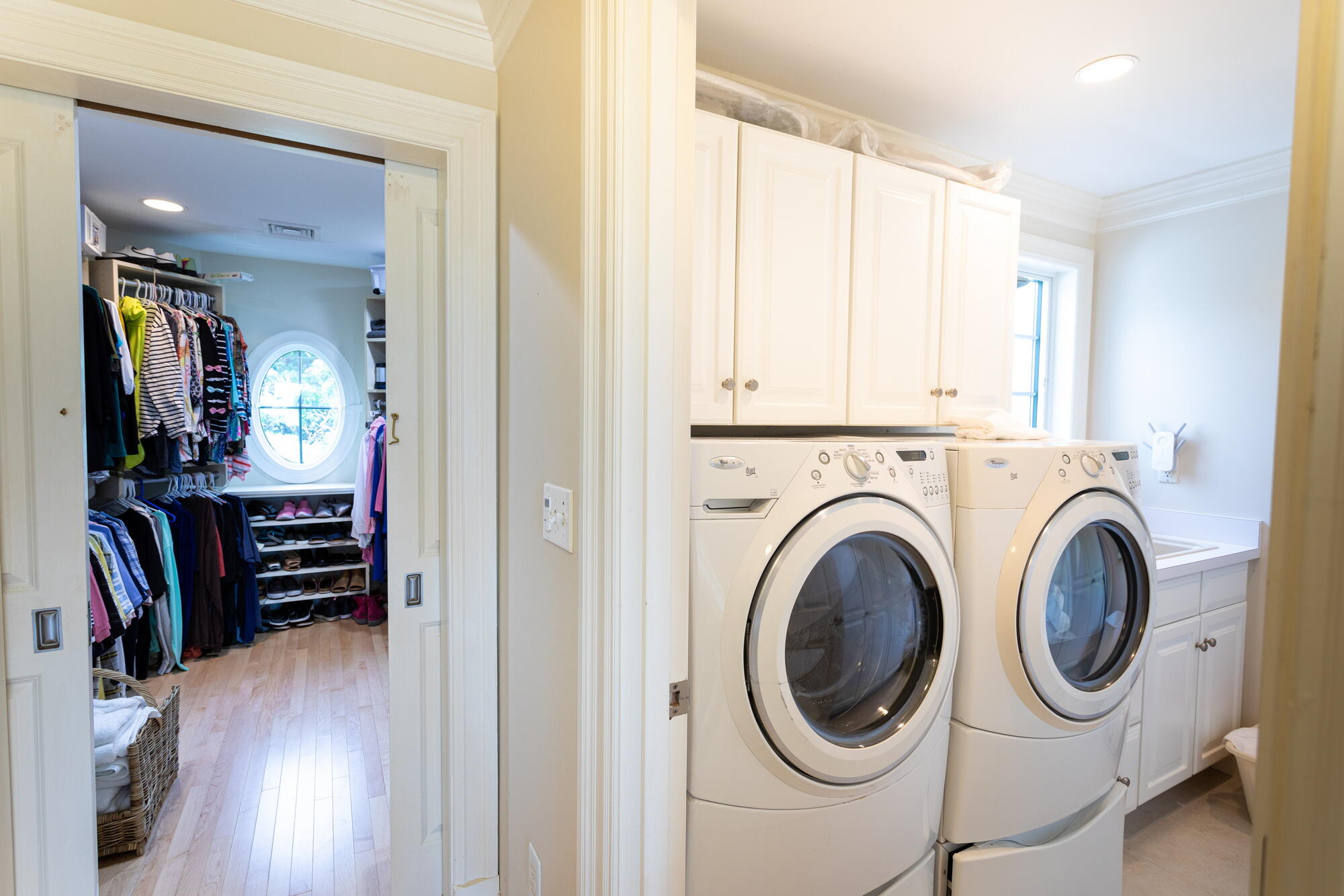 157 Monomoscoy Road Mashpee, MA 02649 - Photo 27 of 43 a view of a hallway with washer and dryer