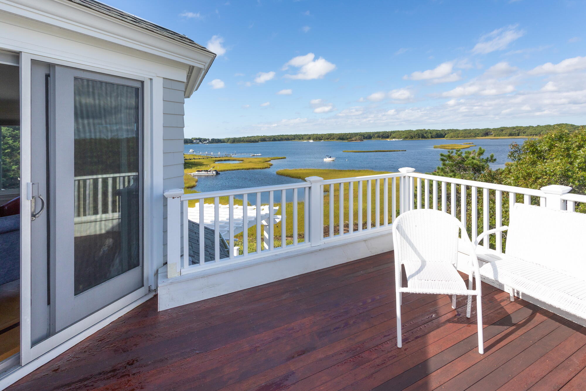 157 Monomoscoy Road Mashpee, MA 02649 - Photo 31 of 43 a view of a chair and table in the balcony