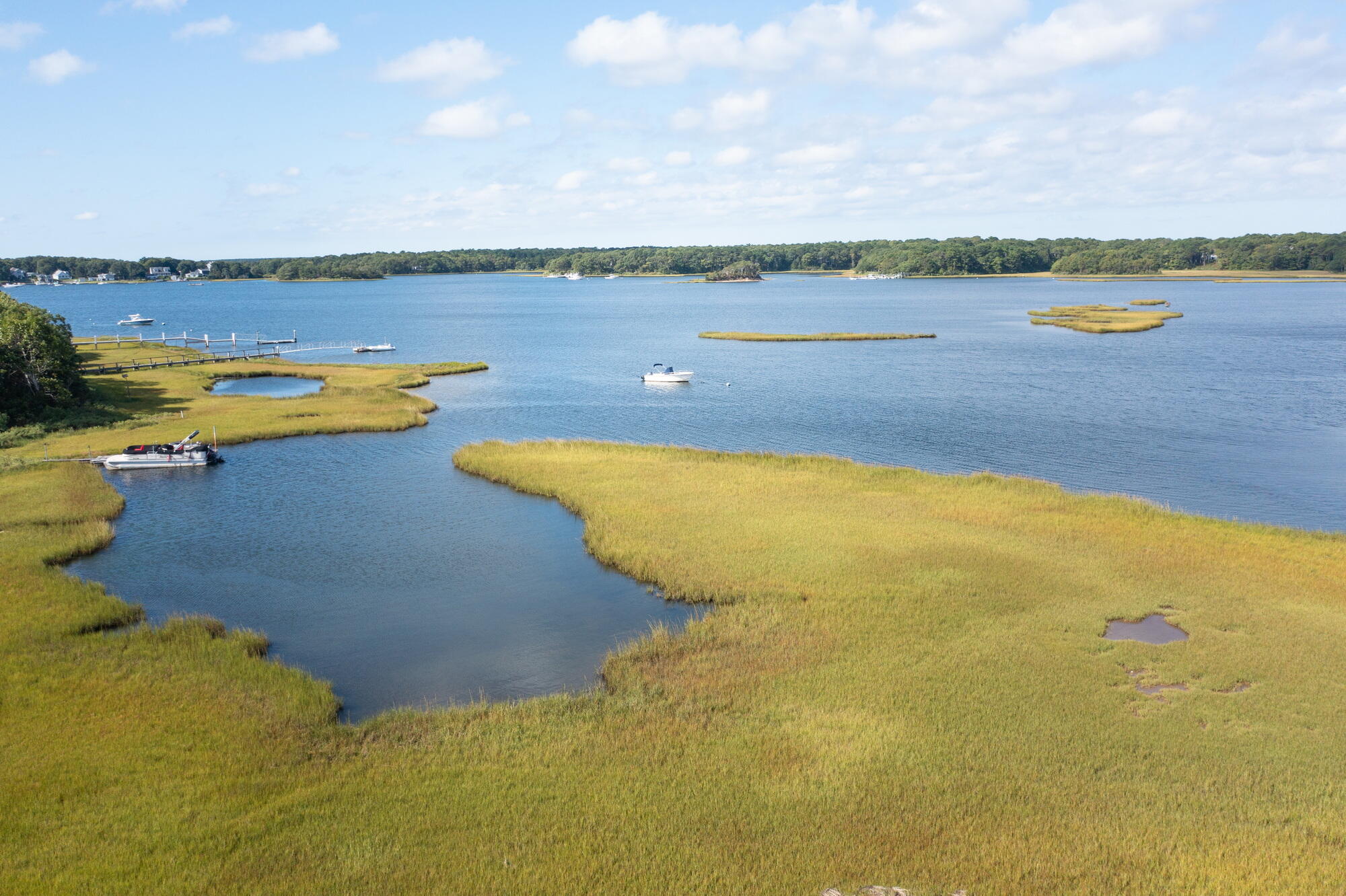 157 Monomoscoy Road Mashpee, MA 02649 - Photo 34 of 43 a view of a lake with a mountain