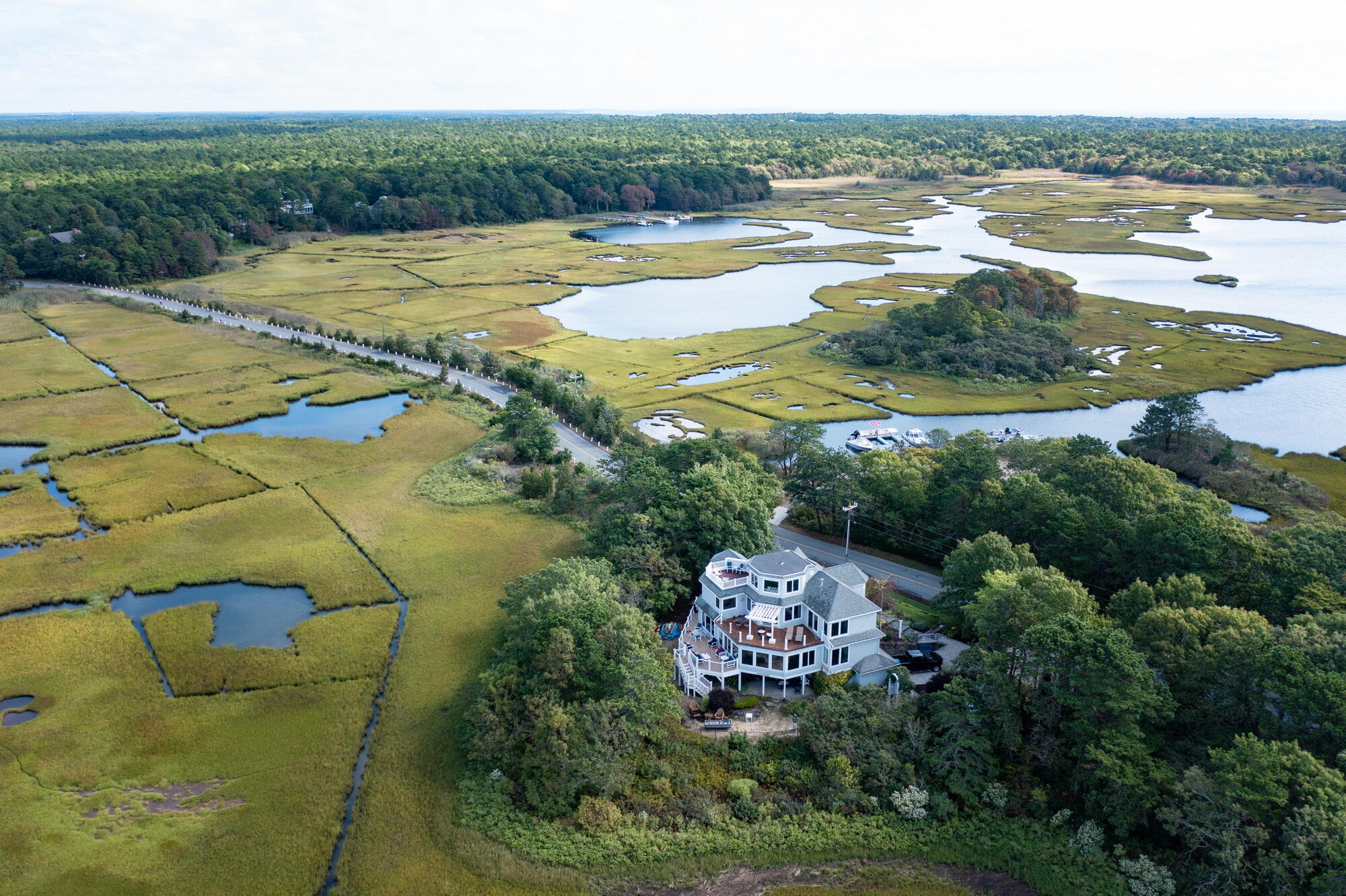 157 Monomoscoy Road Mashpee, MA 02649 - Photo 40 of 43 a view of a swimming pool with a yard and large trees