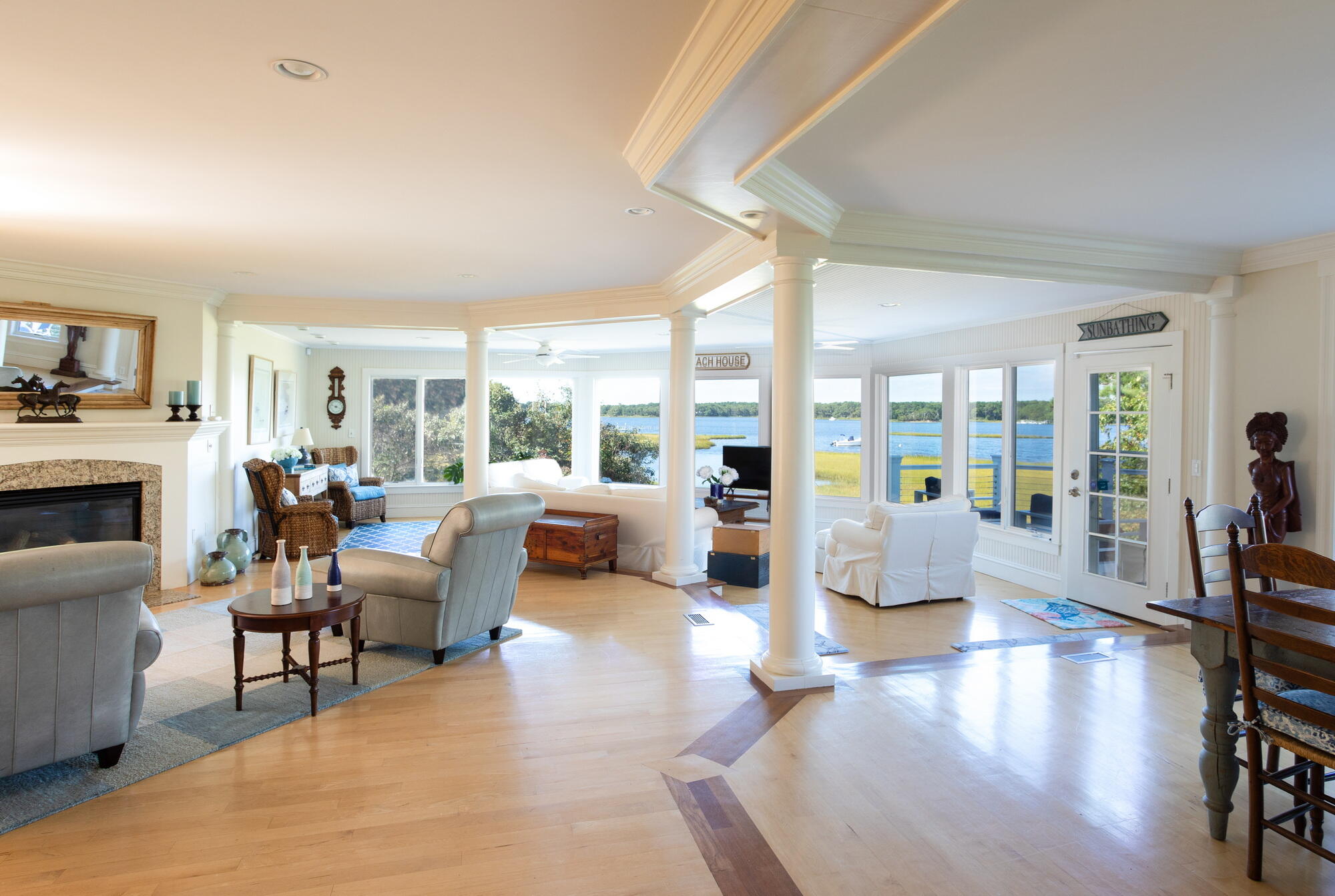 157 Monomoscoy Road Mashpee, MA 02649 - Photo 6 of 43 a living room with fireplace furniture and a large window