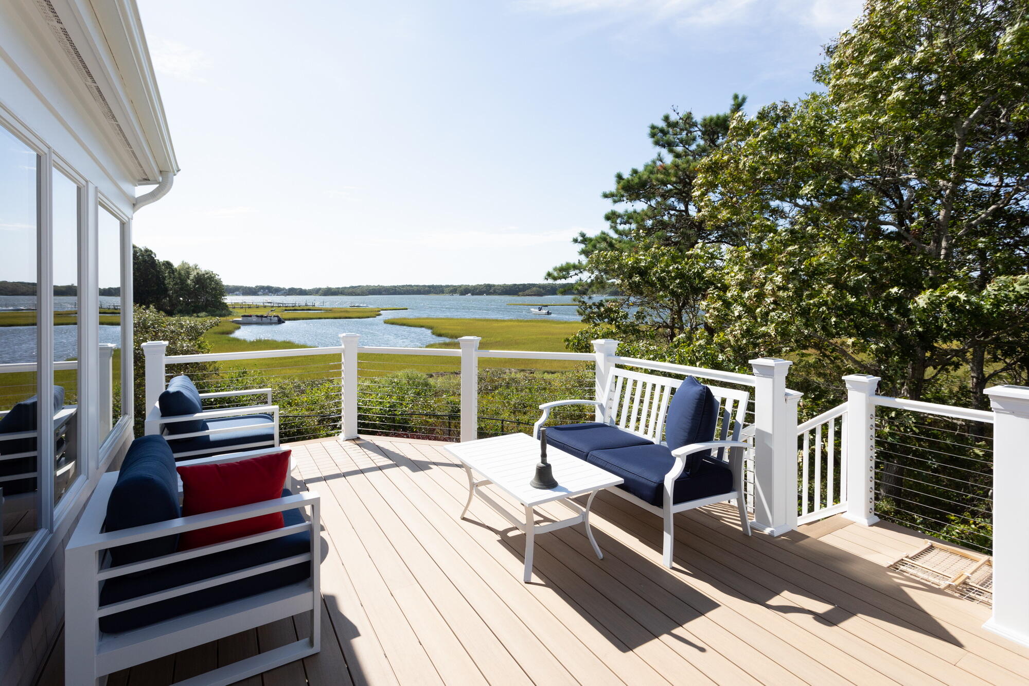 157 Monomoscoy Road Mashpee, MA 02649 - Photo 8 of 43 a view of balcony with couch and outdoor view