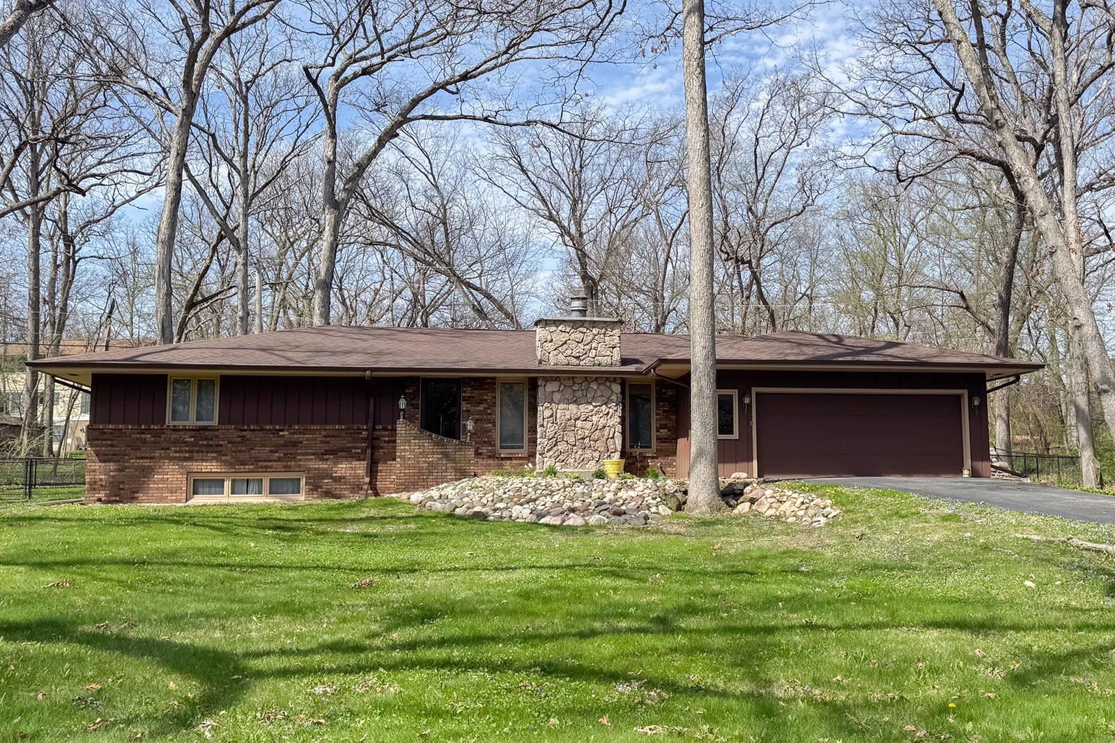 10401 Ray Drive Roscoe, IL 61073 - Photo 1 of 38 a front view of a house with garden