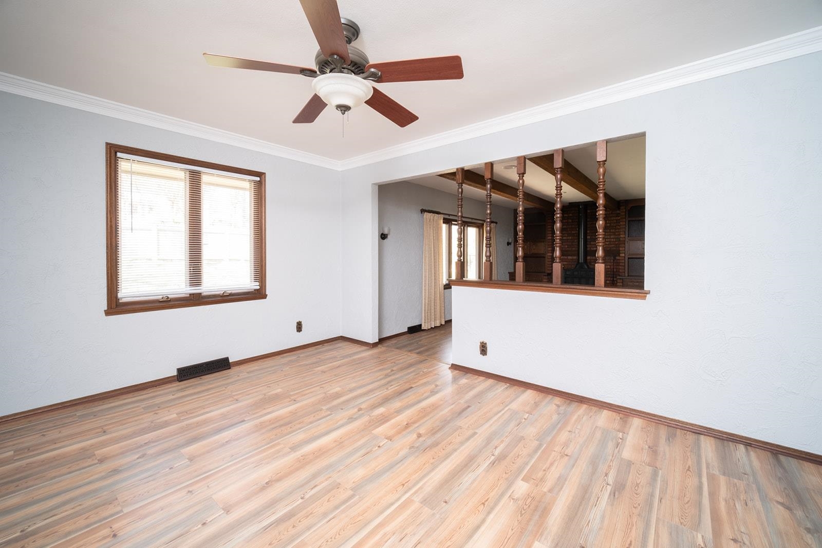 10401 Ray Drive Roscoe, IL 61073 - Photo 12 of 38 a view of an empty room with wooden floor and a window
