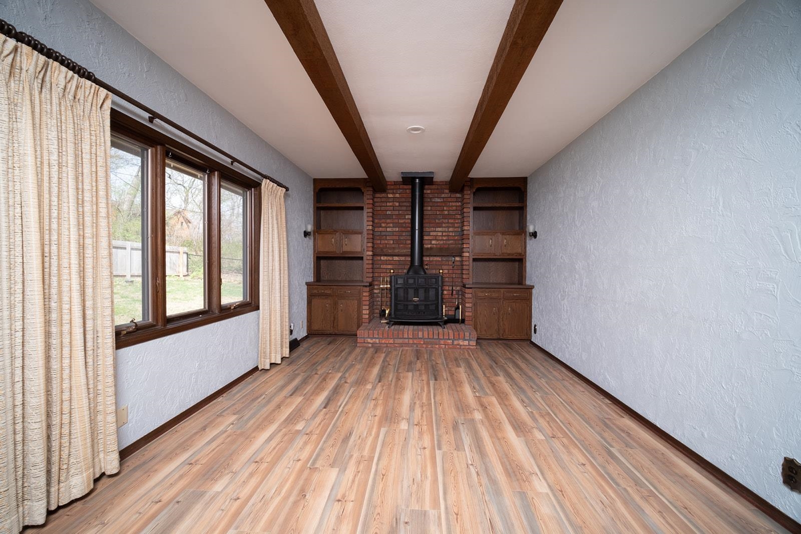 10401 Ray Drive Roscoe, IL 61073 - Photo 15 of 38 a view of empty room with wooden floor and fan