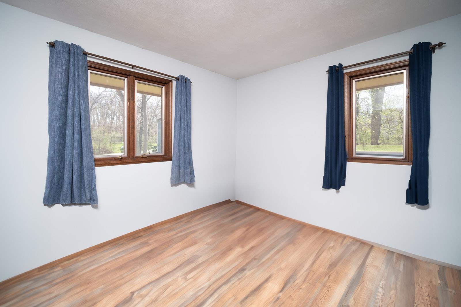 10401 Ray Drive Roscoe, IL 61073 - Photo 25 of 38 a view of an empty room with wooden floor and a window