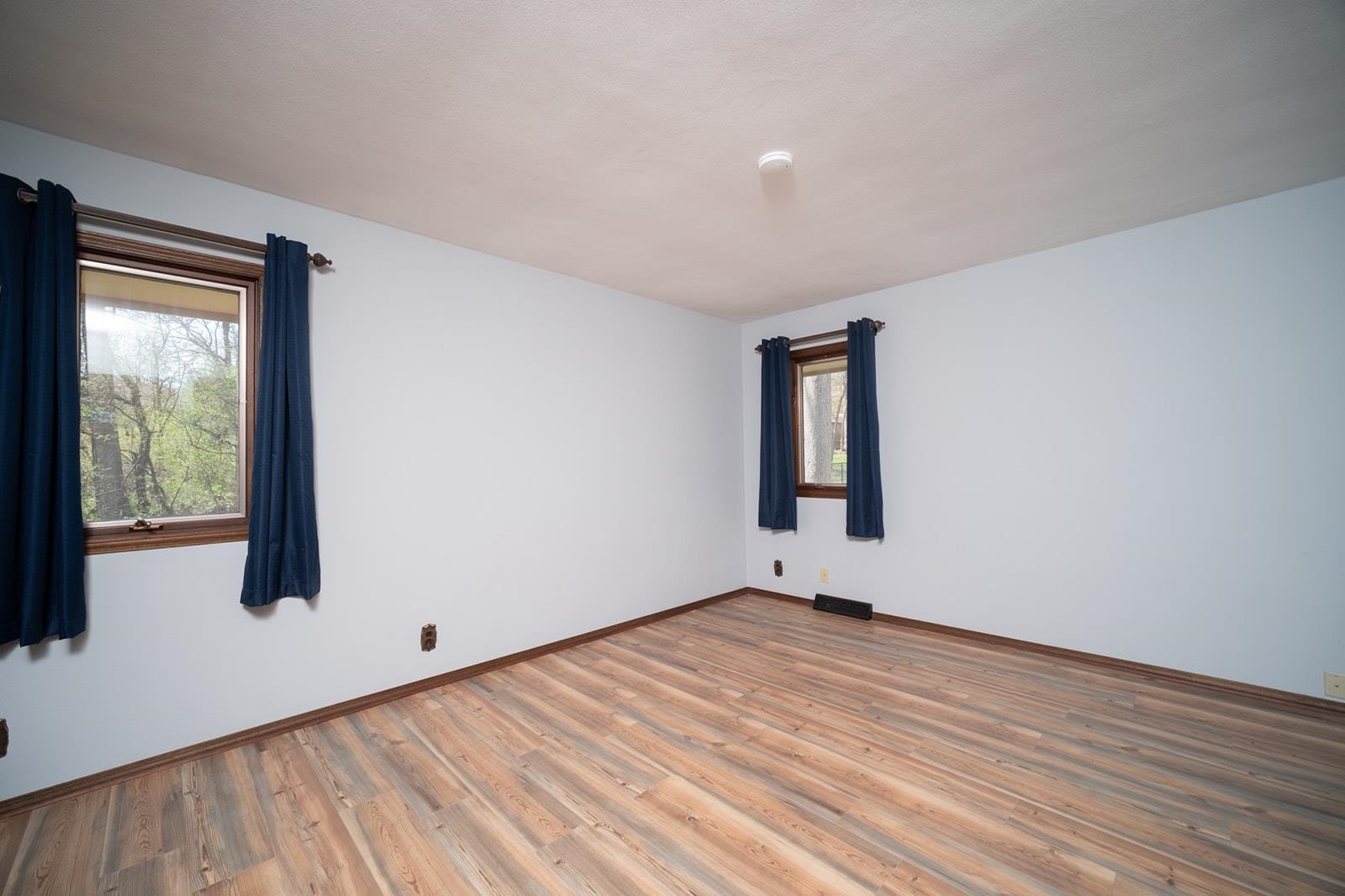 10401 Ray Drive Roscoe, IL 61073 - Photo 27 of 38 a view of an empty room with wooden floor and a window