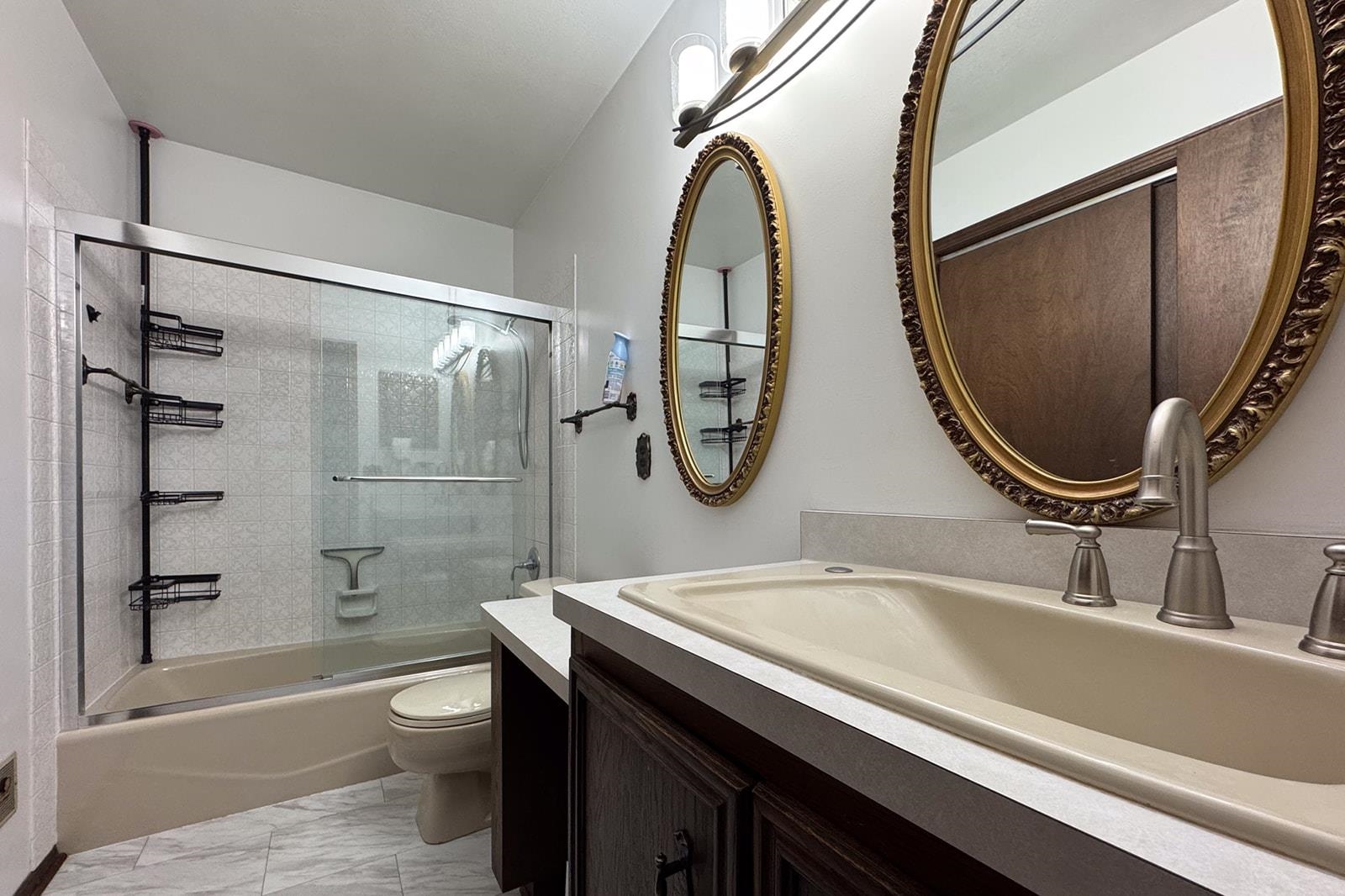 10401 Ray Drive Roscoe, IL 61073 - Photo 29 of 38 a bathroom with a sink a toilet and a mirror