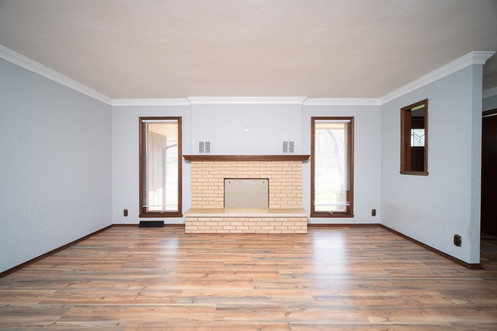 10401 Ray Drive Roscoe, IL 61073 - Photo 10 of 38 a view of empty room with wooden floor and fireplace