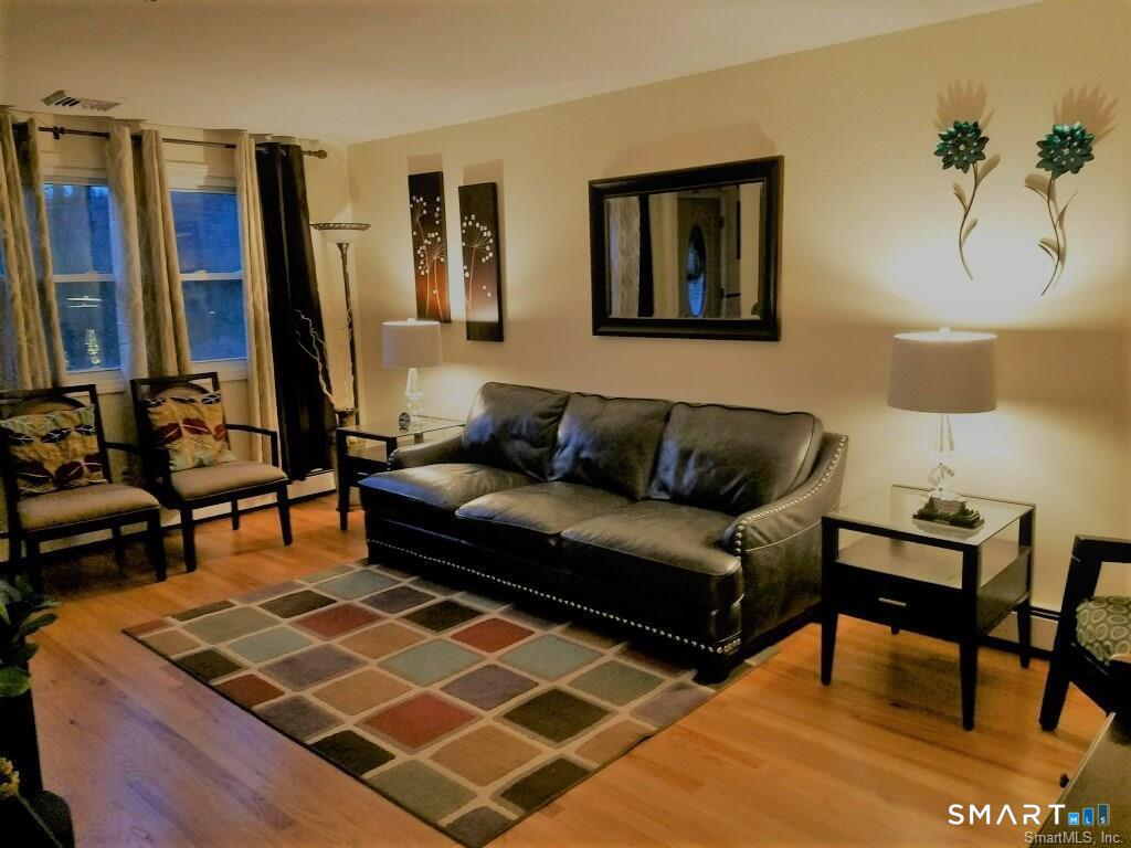 54 Berkshire Road West Hartford, CT 06107 - Photo 4 of 26 Warm and welcoming, the living room is a favorite place for family to get together.