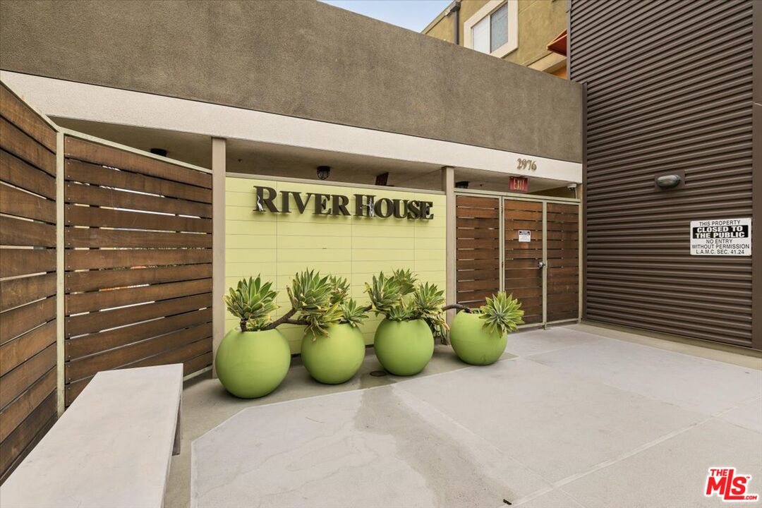 a front view of a house with outdoor seating